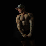 Side view of man wearing Charcoal Chic snapback cap – 3D embroidery and structured fit visible