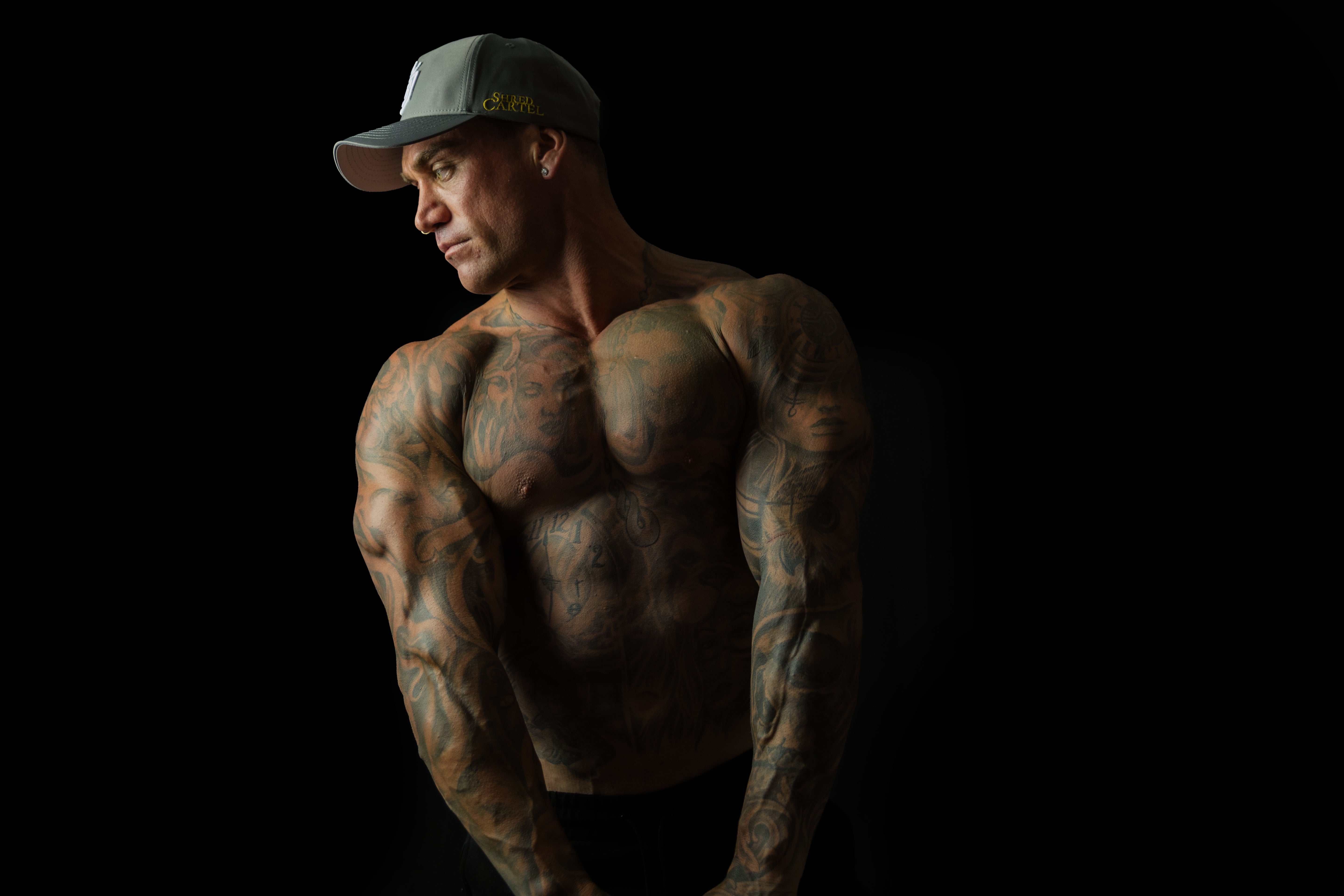 Man wearing Charcoal Chic sweat-resistant snapback cap front view – Shred Cartel Elite Series