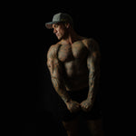 Side view of man wearing Charcoal Chic snapback cap – 3D embroidery and structured fit visible
