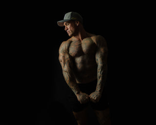 Side view of man wearing Charcoal Chic snapback cap – 3D embroidery and structured fit visible