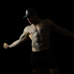 Model wearing black and pink sweat-resistant snapback cap front view – Shred Cartel Elite Series