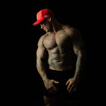 Model showcasing Shred Cartel Elite Series bloodred cap