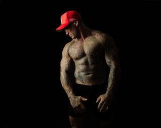 Model showcasing Shred Cartel Elite Series bloodred cap