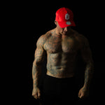 Model showcasing Shred Cartel Elite Series bloodred cap