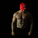 Model showcasing Shred Cartel Elite Series bloodred cap