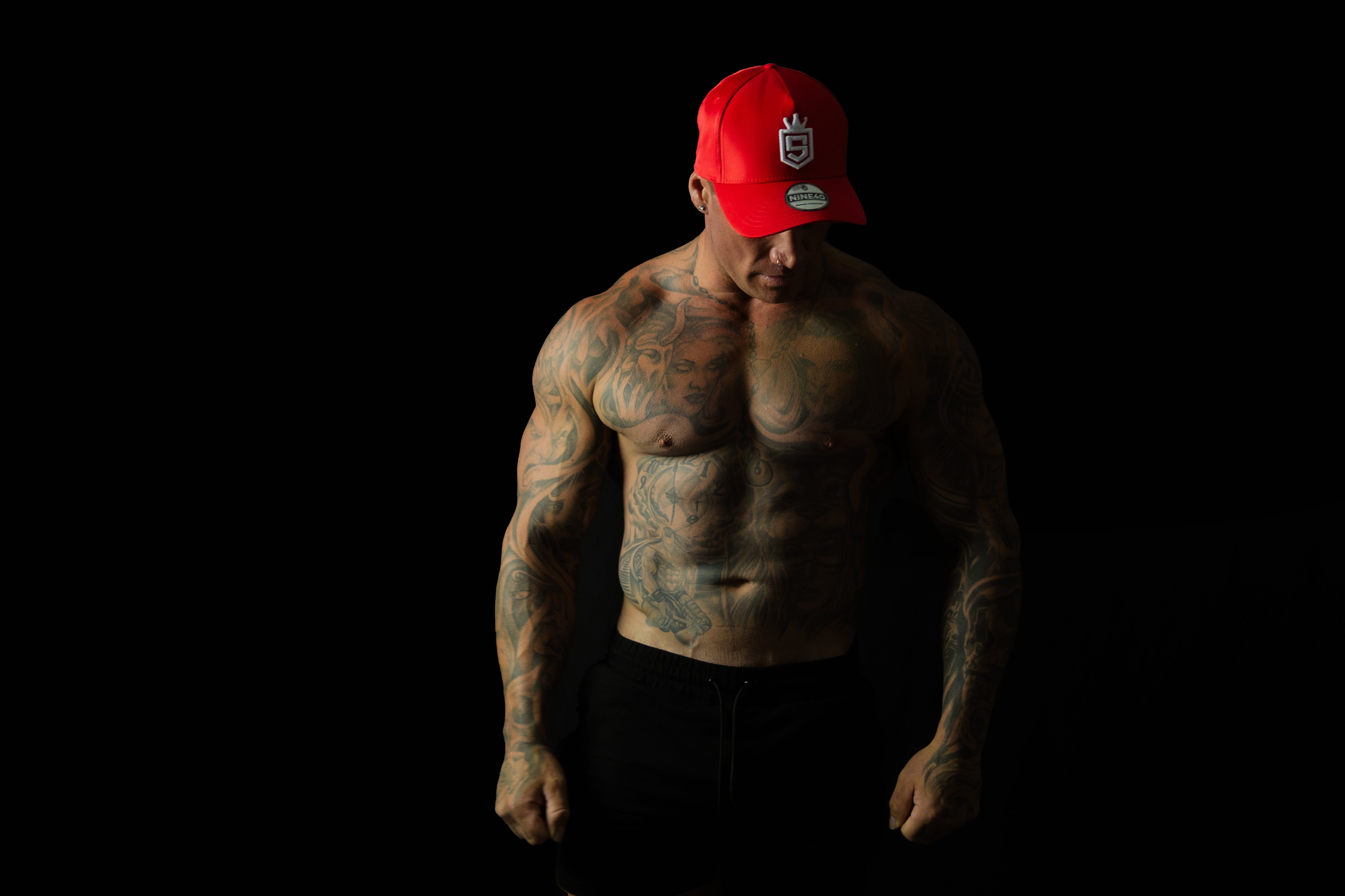 Model showcasing Shred Cartel Elite Series bloodred cap