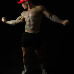Model showcasing Shred Cartel Elite Series bloodred cap