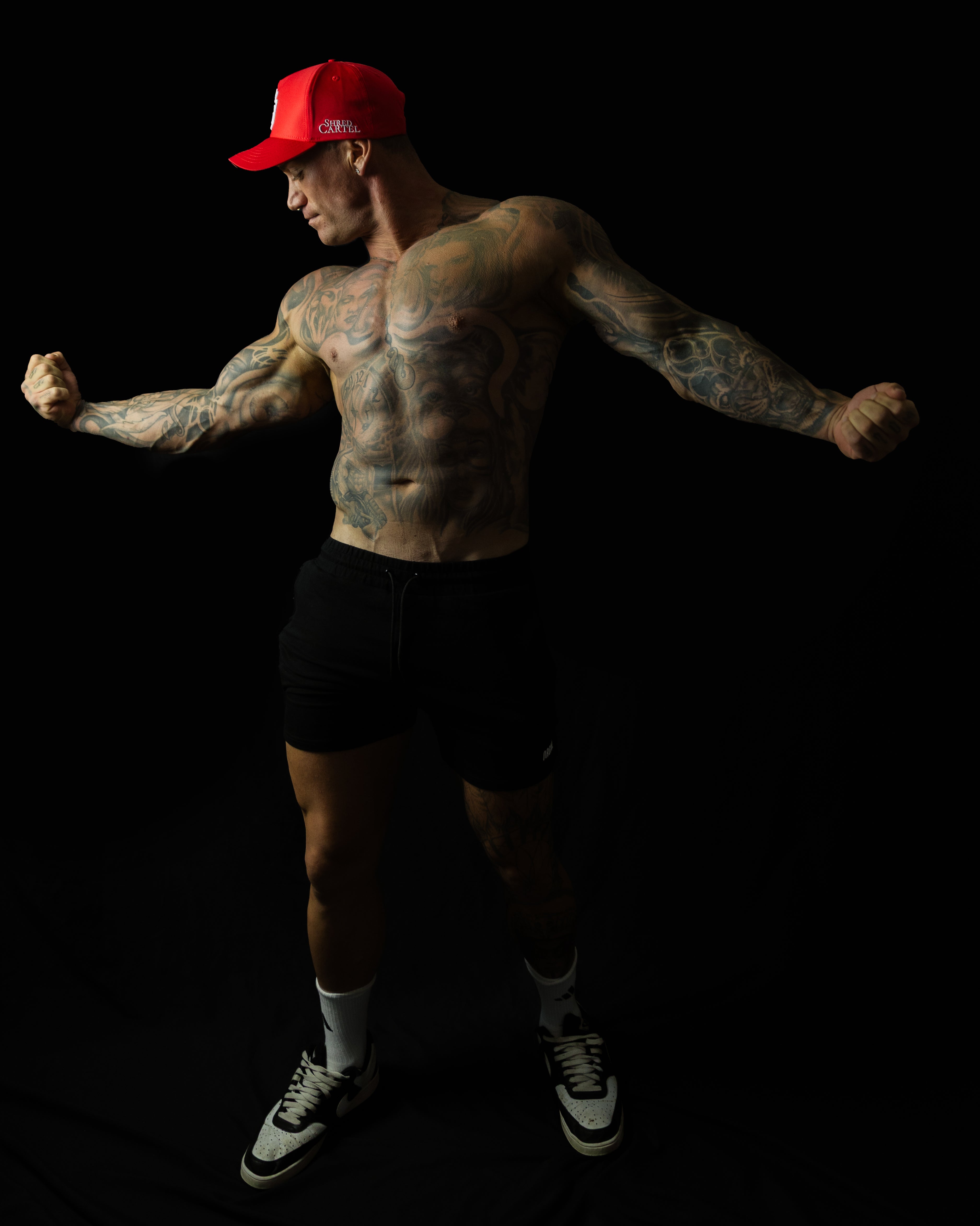 Model showcasing Shred Cartel Elite Series bloodred cap
